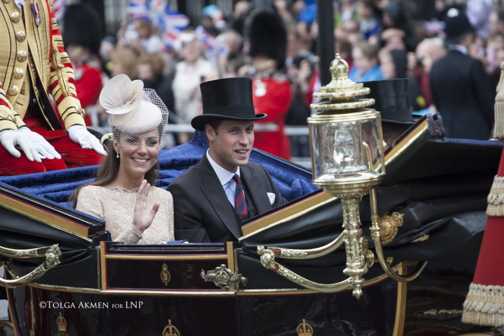 © Licensed to London News Pictures. 05/06/2012. London, UK. The Royal Jubilee celebrations. Duke and Duchess of Cambridge riding along Whitehall as Great Britain is celebrating the 60th anniversary of the countries Monarch HRH Queen Elizabeth II accession to the throne this weekend. Photo credit : Tolga Akmen/LNP